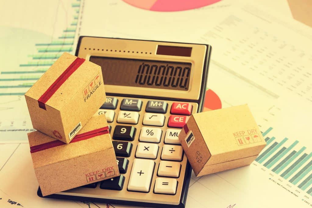 closeup,three,cardboard,boxes,packing,the,product,and,calculator,on