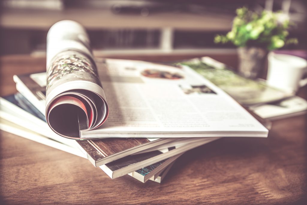 selective,focus,of,the,stacking,magazine,place,on,table,in