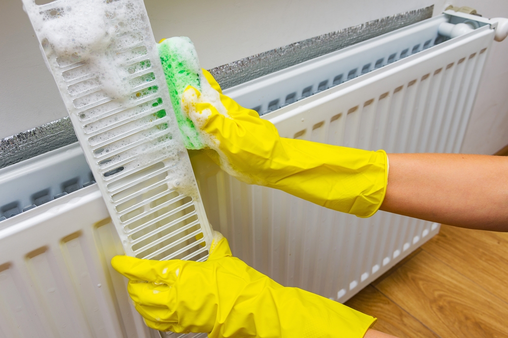 cleaning,a,radiator,heating,at,home.,preparing,the,house,,heating