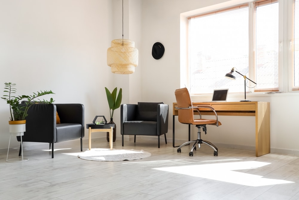interior,of,modern,office,with,workplace,and,black,armchairs
