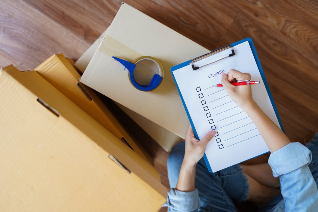 top,view,of,woman,checking,goods,package,or,packing,before