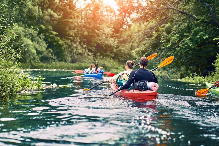 group,of,young,people,on,kayak,outing,rafting,down,the