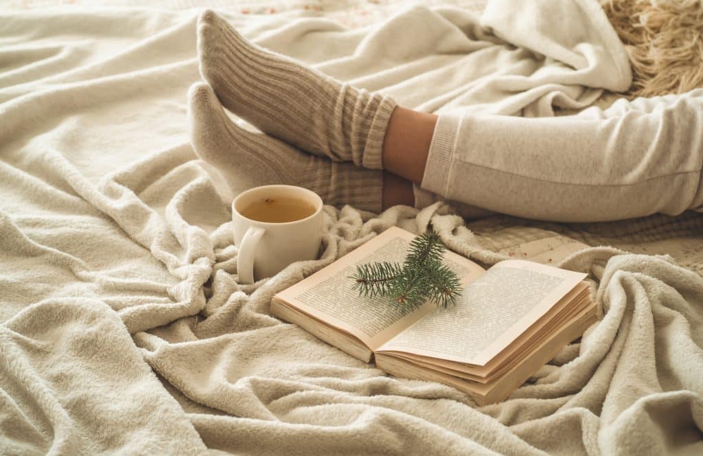 cozy,winter,evening,,,warm,woolen,socks.,woman,is,lying