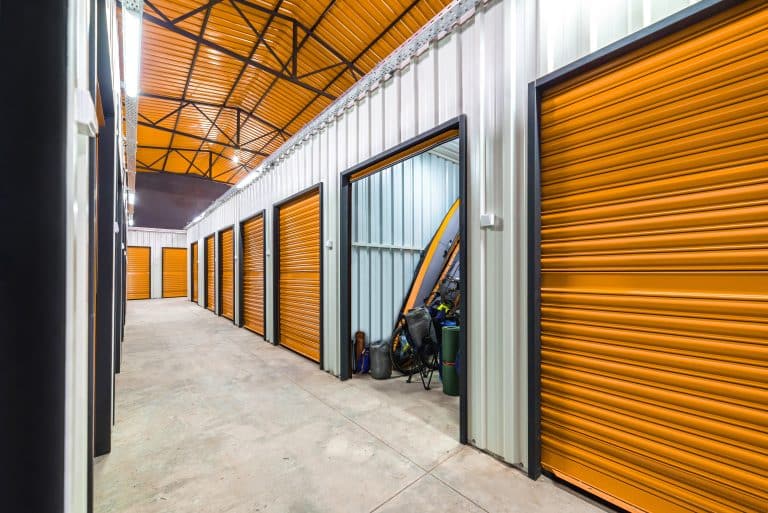 corridor,of,self,storage,unit,with,red,doors.,rental,storage