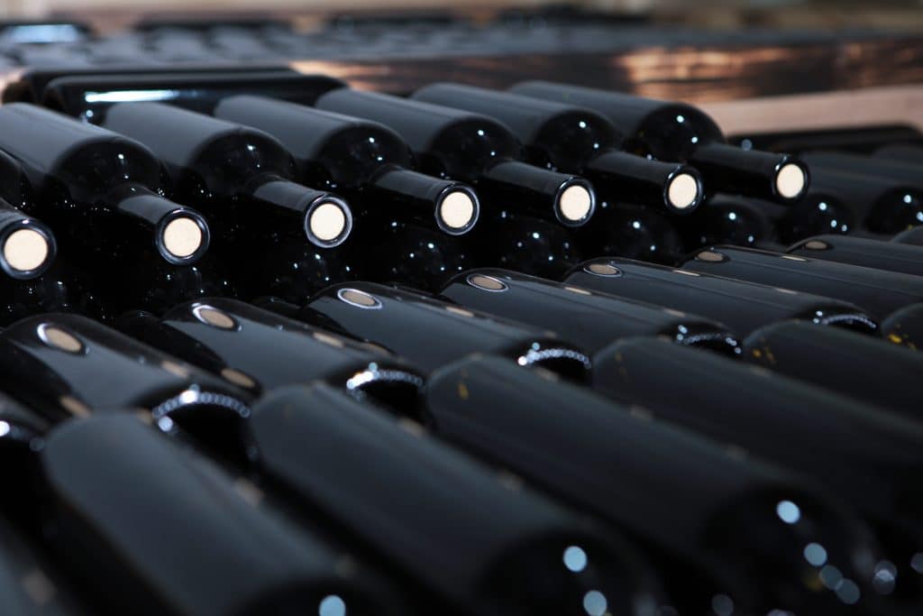 stacks,of,wine,bottles.,wine,storage.,young,white,wine,in